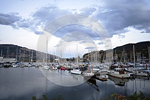 Yachts and boats moored at the piers in the bay of the Columbia River