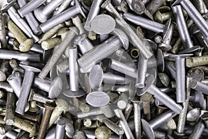 Various sizes of aluminum rivets. Accessories for joining machine parts stacked