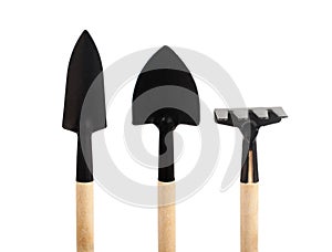 Various small gardening tools close-up on a white background
