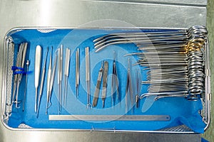 Various sorted surgical instruments in a tray