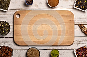 Various spice in bowls on table. Frame for text