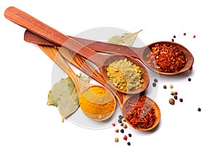 Various spices and herbs over white