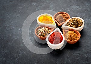 Various Spices, herbs and spicy spices in bowls.