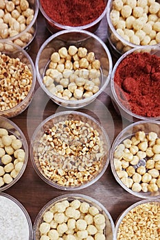 Various spices, nuts and additives on the table.