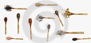 Various spices spoons on white table. Top view with copy space.