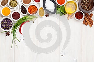 Various spices on white wooden background