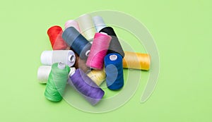 Various spools of sewing cotton thread of different colors