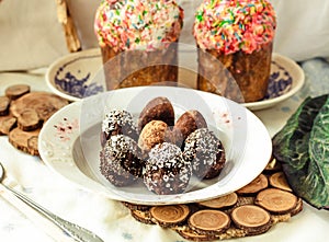 Various Spring Easter cakes with white icing and sugar decor on