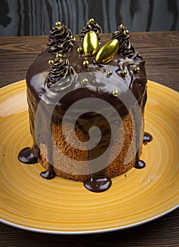 Various Spring Easter cakes with white icing and sugar decor on the table decorated in rustic style