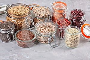 Various superfoods goji berries, quinoa, chia, hemp seeds, chickpeas, oats, linseeds and lantils