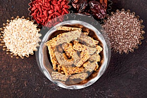 Various superfoods in small bowl near granola