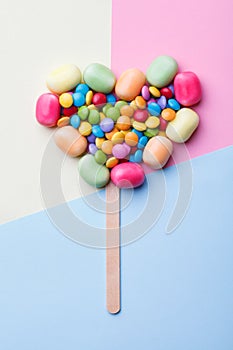 various sweets, colorful candies arranges as heart lollypop
