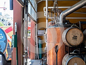 Various tanks, barrels, and beer making equipment at brewery photo