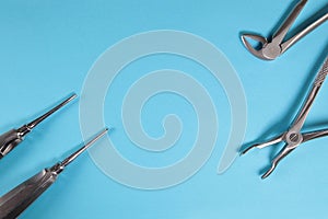 Various tools for dentists on a blue background.