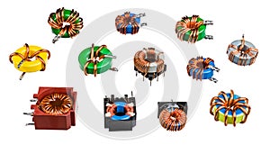 Various toroidal inductors and transformers isolated on a white background photo