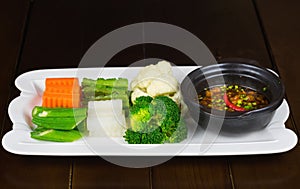 Various type of boiled vegetable eating with braided fish sauce. Common food in South of Vietnam. Asian food