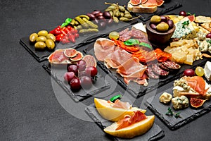 Various type of italian meal or snack - cheese, sausage, olives and parma