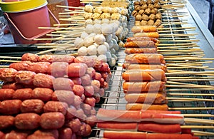 Various Types of Asian Sausages, Meat Balls and Fish Balls on Skewers