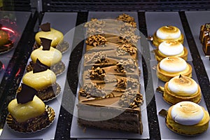 Various types of cakes, tart, mousse, pies for sale in bakery or pastry shop, gourmet luxury concept