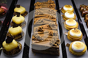 Various types of cakes, tart, mousse, pies for sale in bakery or pastry shop, gourmet luxury concept