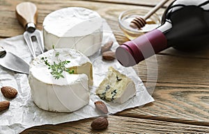 Various types of cheese,  blue cheese,  bree, camambert and wine