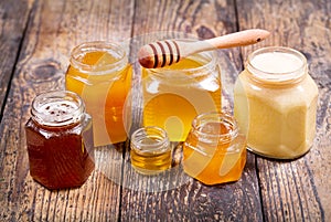 Various types of honey in glass jars