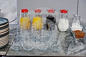 Various types of juices in glass pitchers