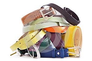 Various types of leather belts isolated on white background