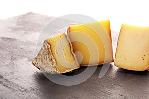 Various types of organic cheese on rustic vintage table