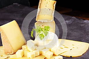 Various types of organic cheese on rustic vintage table