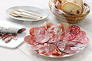 Various types of spanish salami, sausage and ham. photo