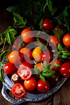 A various types of tomatoes served and presented on the silver platter.