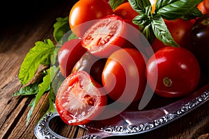 A various types of tomatoes served and presented on the silver platter.