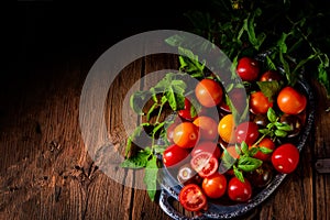 A various types of tomatoes served and presented on the silver platter.