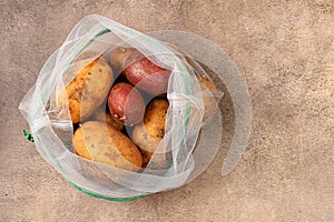 Various varieties of potatoes in fabric packaging. Healthy natural products in an eco bag to boost immunity, healthy lifestyle