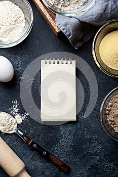 Various vegetable gluten free flour corn,sesame,oat,coconut in glass bowl on dark gray background