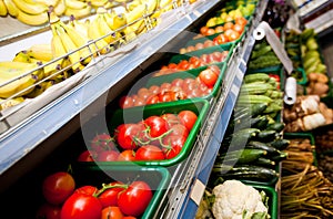 Various vegetables and fruits on display in supermarket