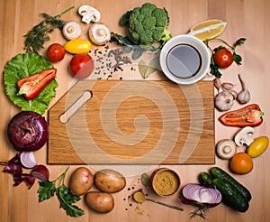 Various vegetables and spices and empty cutting board. Colorful