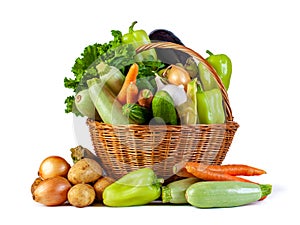 Various vegetables in a wicker basket isolate on white background