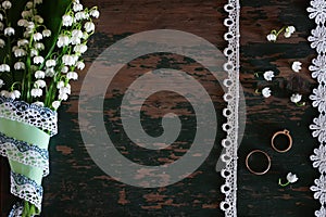 Wedding bouquet of lilies of the valley and rings