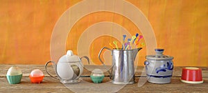 Various vintage kitchen utensils from the seventies with vibrant colors, pop and trashy style kitchen still life photo