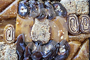 Various walnut, pistachio, hazelnut pestils. Turkish deserts. similar to turkish delight. close-up macro photo.