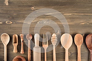 Various wooden kitchen utensils on table