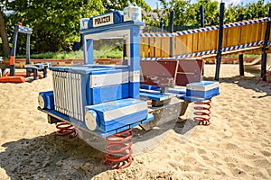 Various wooden playground equipment on a public playground in Berlin