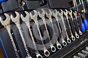 Various work tools hanging in case of handyman. Home construction concept