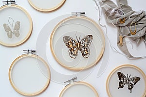 varioussized hoops with progressing stages of a butterfly design