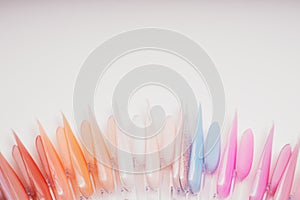 Varnish color palette for nail painting. Multicolored samples of nail polish. Manicure background. Nail art design wheel