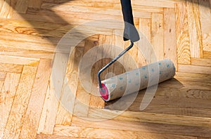 Varnished parquet roller