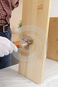 Varnishing a plank