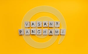 Vasant Panchami, a minimalistic banner with an inscription in wooden letters